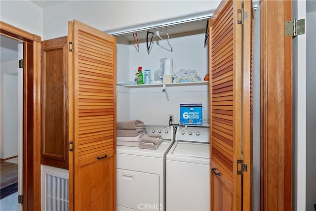 clothes washing area featuring washing machine and dryer