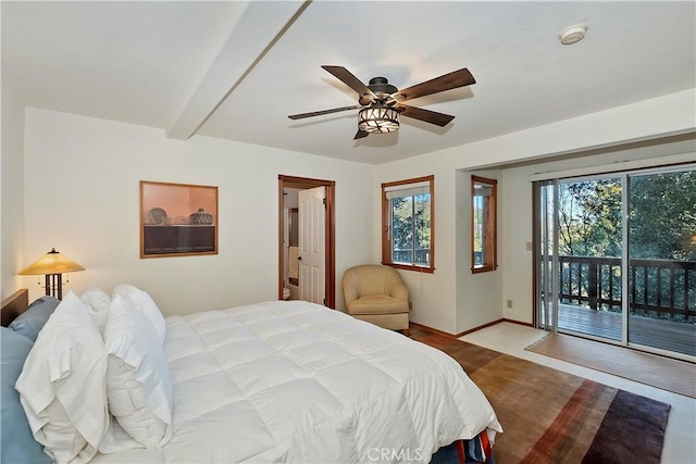 bedroom with multiple windows, beam ceiling, access to outside, and ceiling fan