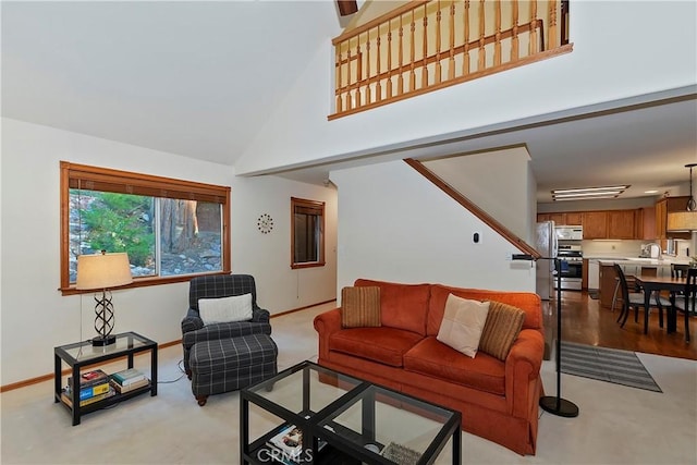 living room with sink and a towering ceiling