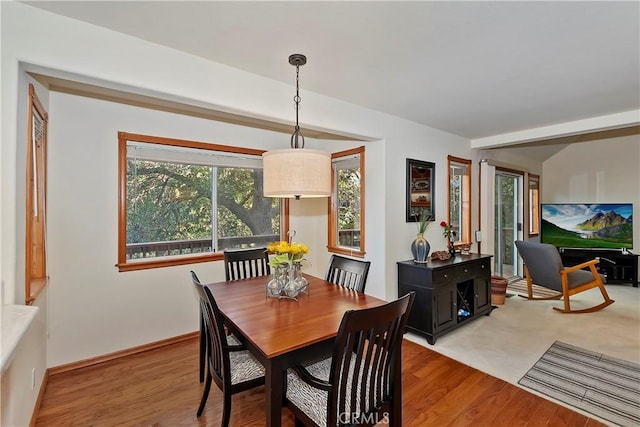 dining space featuring light wood-type flooring