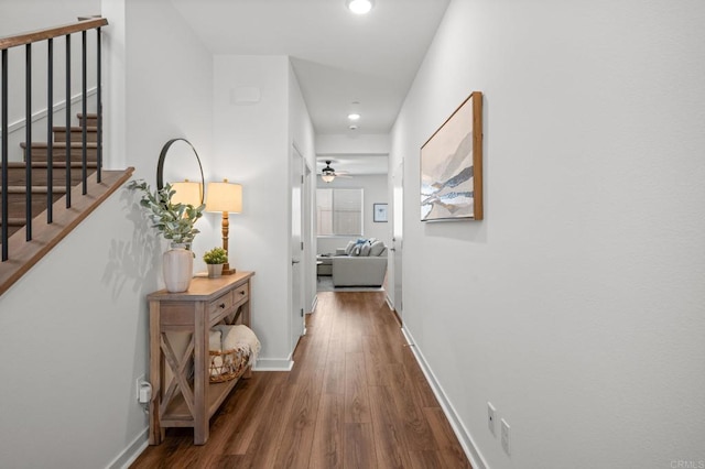 corridor with hardwood / wood-style flooring