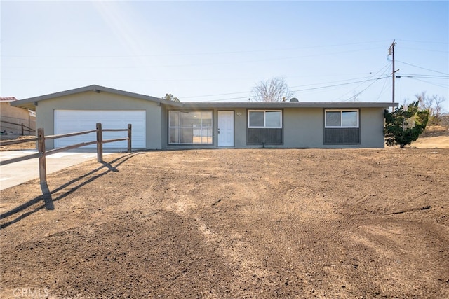 single story home featuring a garage