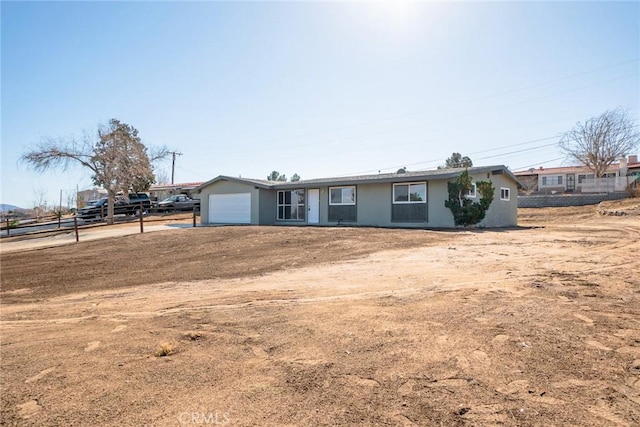 ranch-style home with a garage