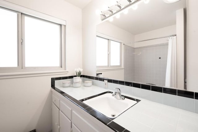 bathroom with vanity and a shower with shower curtain