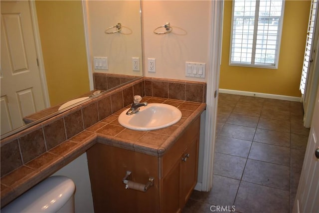 bathroom with tile patterned floors, toilet, and vanity