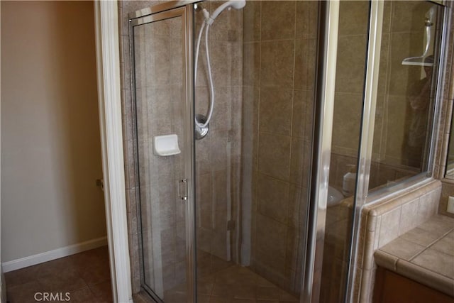 bathroom with walk in shower and tile patterned floors