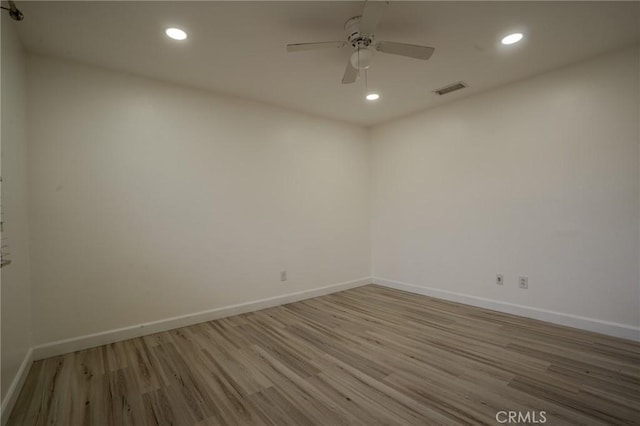 empty room featuring light hardwood / wood-style floors and ceiling fan