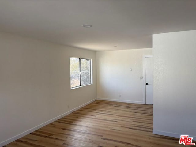 unfurnished room featuring light hardwood / wood-style floors