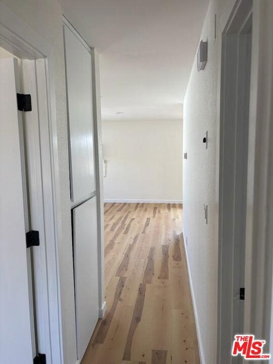 hallway featuring light wood-type flooring