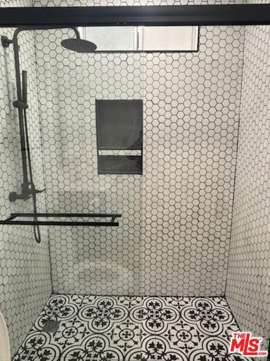 room details with a tile shower