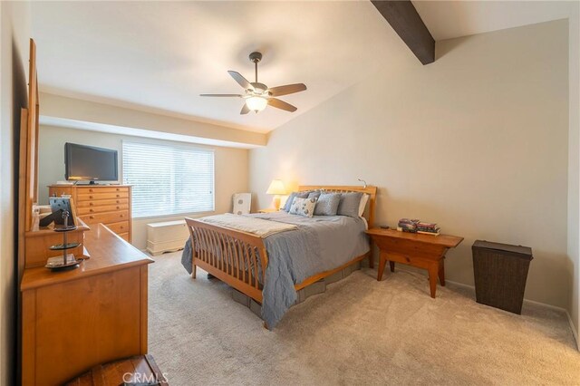 bedroom with a ceiling fan, light colored carpet, and vaulted ceiling with beams