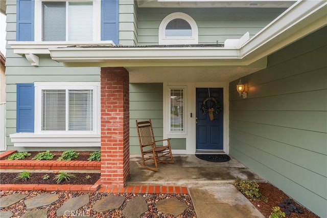 doorway to property with a porch