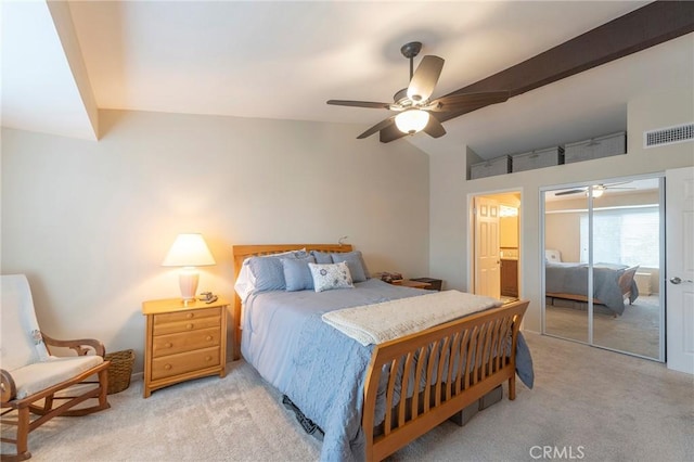 bedroom with ceiling fan, light colored carpet, and vaulted ceiling with beams