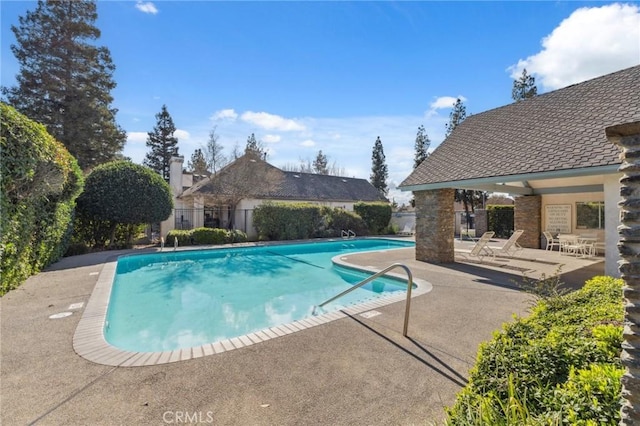 view of swimming pool featuring a patio area