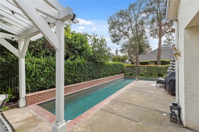 view of swimming pool with a pergola and a patio