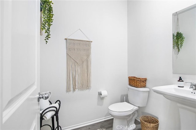30219 Old Mill Rd, Menifee, CA 92584 - half bath with toilet, wood finished floors, and baseboards