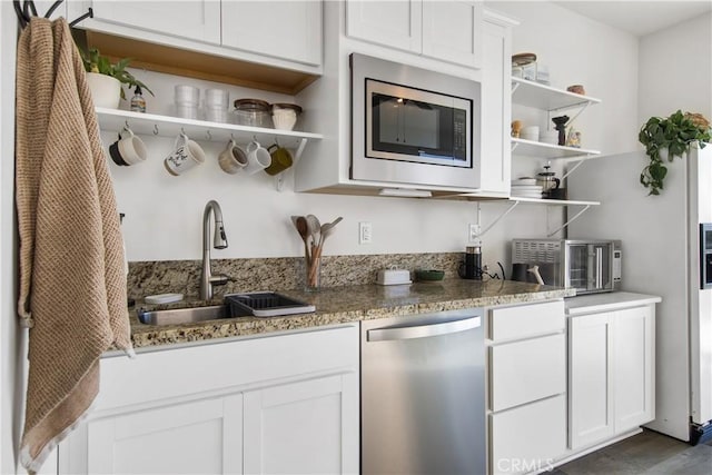 30219 Old Mill Rd, Menifee, CA 92584 - kitchen featuring open shelves, stainless steel appliances, a sink, white cabinets, and stone countertops