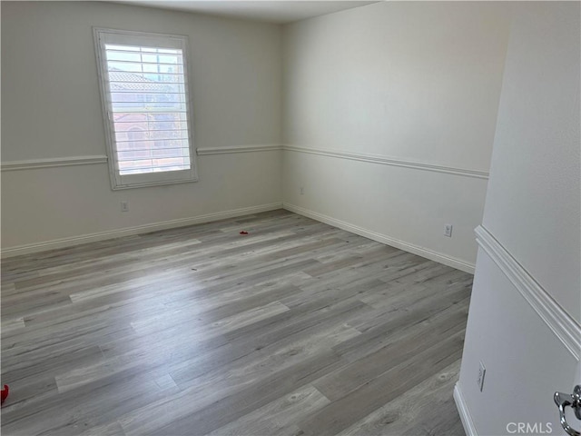 unfurnished room featuring light hardwood / wood-style flooring