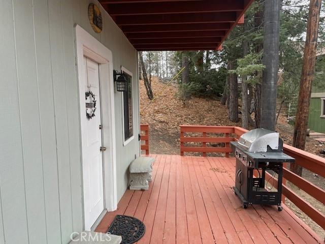 wooden deck with grilling area