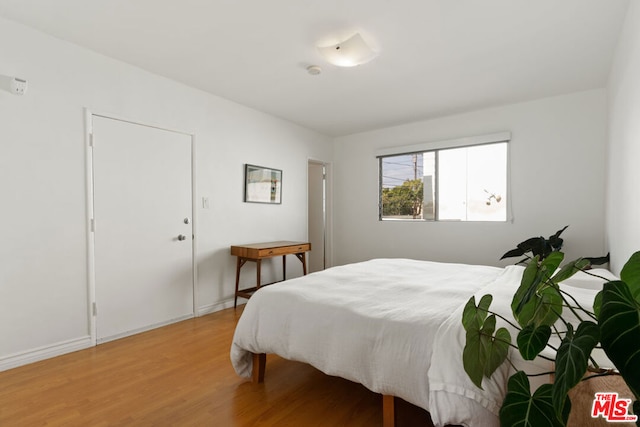 bedroom featuring hardwood / wood-style flooring