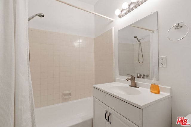 bathroom with vanity and shower / bath combination with curtain