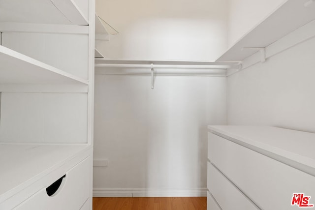 walk in closet featuring light wood-type flooring