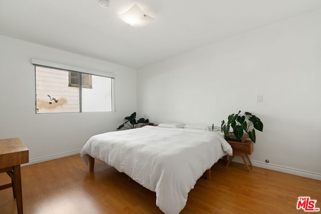 bedroom featuring wood-type flooring