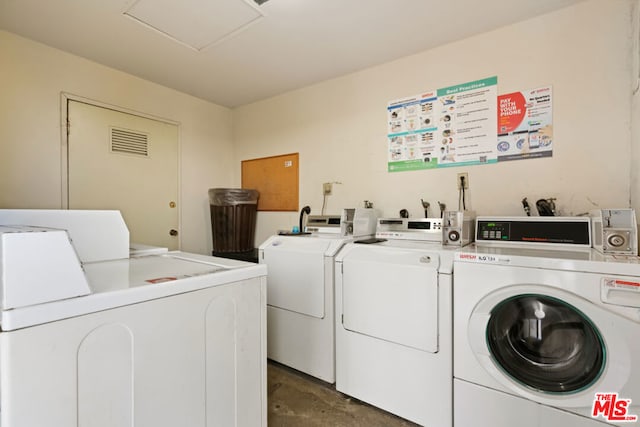 washroom with washer and dryer