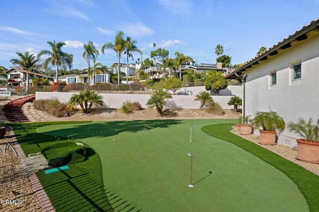 view of home's community with a fenced backyard and a residential view