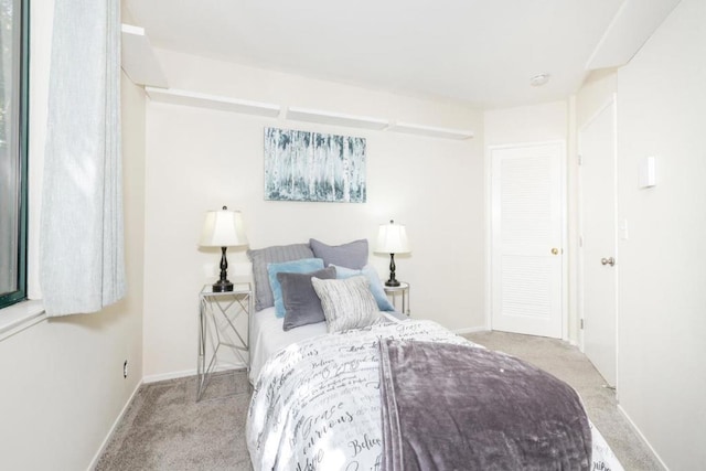 bedroom with light colored carpet