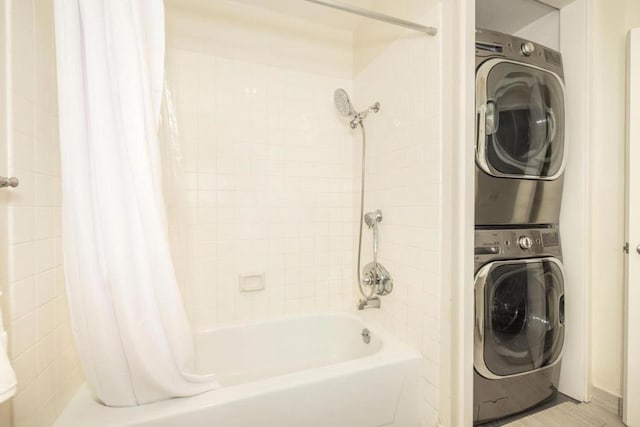 interior space featuring shower / bath combo and stacked washing maching and dryer