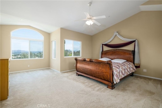 bedroom with light carpet, vaulted ceiling, and ceiling fan