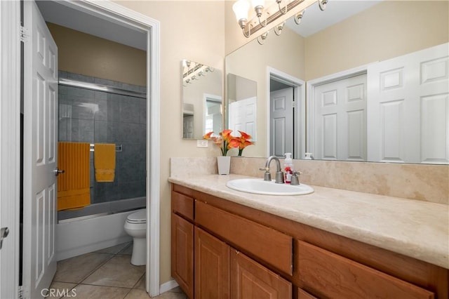 full bathroom with tile patterned flooring, vanity, toilet, and combined bath / shower with glass door