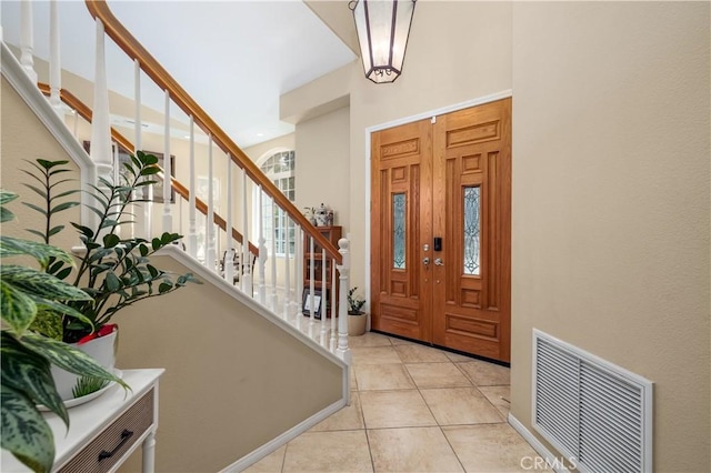 foyer with light tile patterned floors