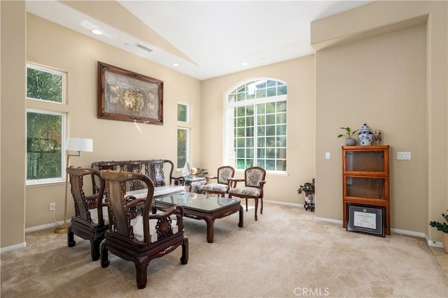 living area featuring light colored carpet