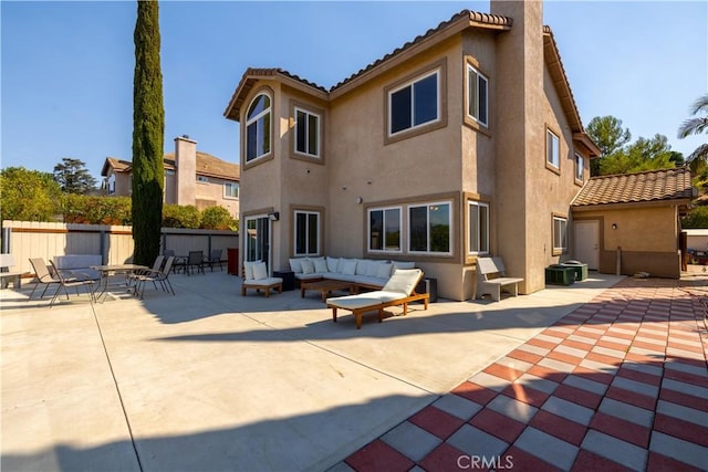 rear view of house with a patio and an outdoor hangout area