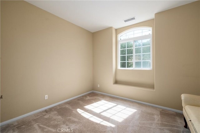 view of carpeted spare room