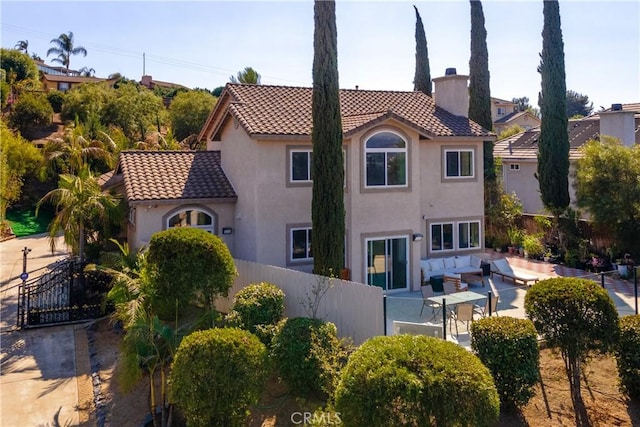 rear view of house featuring an outdoor hangout area and a patio area