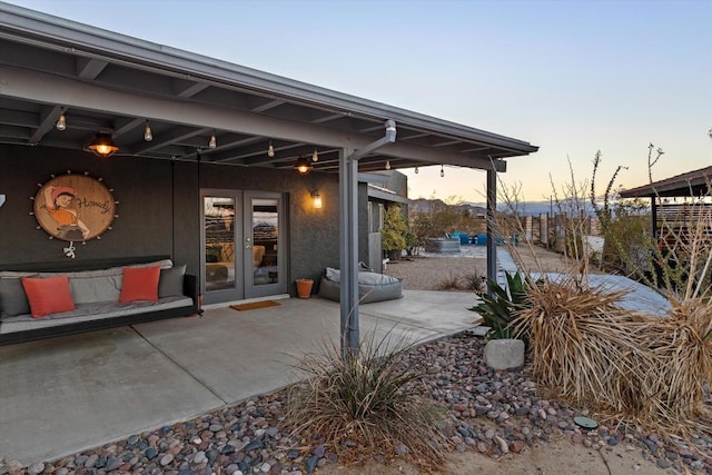 patio terrace at dusk with french doors