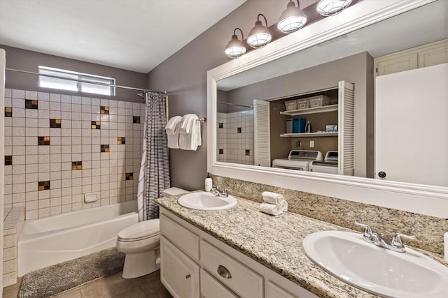 full bathroom featuring shower / tub combo with curtain, tile patterned floors, toilet, washer / dryer, and vanity