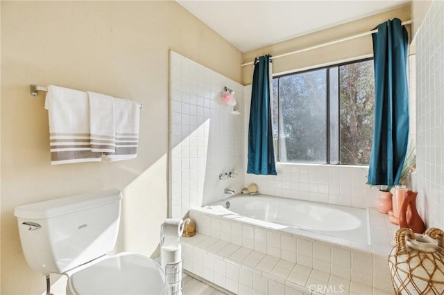 full bath with tiled shower, tiled bath, and toilet