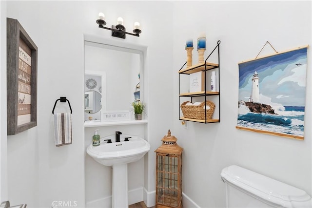 bathroom with sink and toilet