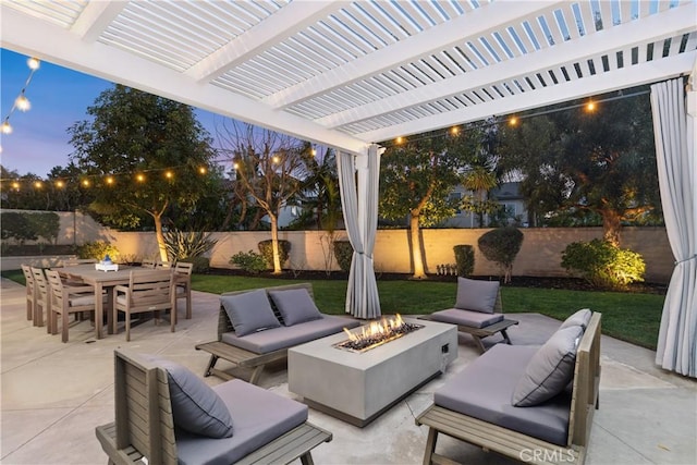 patio terrace at dusk featuring outdoor dining area, an outdoor living space with a fire pit, a fenced backyard, and a pergola