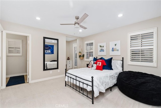 carpeted bedroom featuring ceiling fan