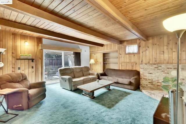 carpeted living room with wood ceiling, beam ceiling, and wood walls