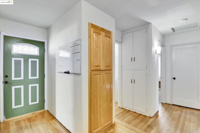 foyer with light hardwood / wood-style flooring