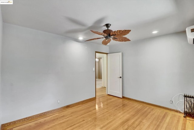 spare room featuring ceiling fan and light wood-type flooring