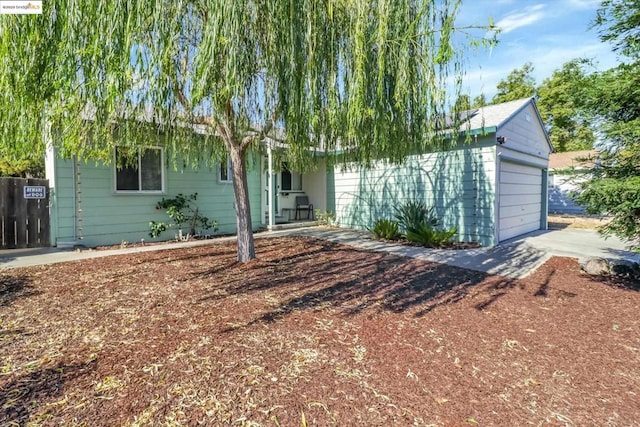 obstructed view of property featuring a garage