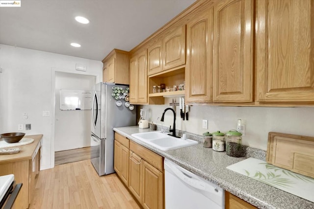 kitchen with stainless steel fridge with ice dispenser, sink, light hardwood / wood-style floors, and dishwasher