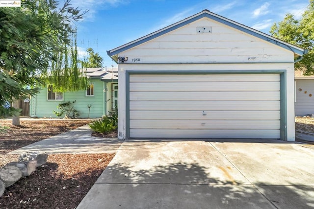 ranch-style home featuring a garage